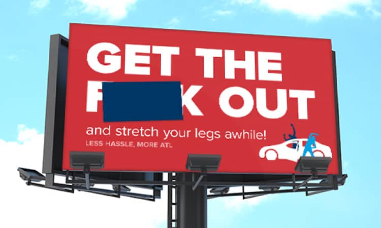 A billboard that says, "GET THE F*** OUT...and stretch your legs awhile!"